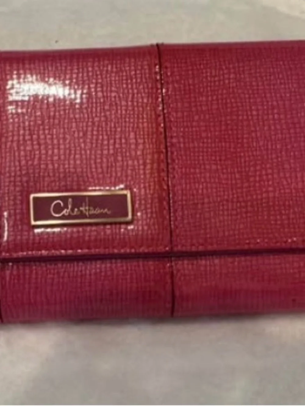 Cole Haan Pink-Red Textured Leather travel jewelry organizer with Gold Logo